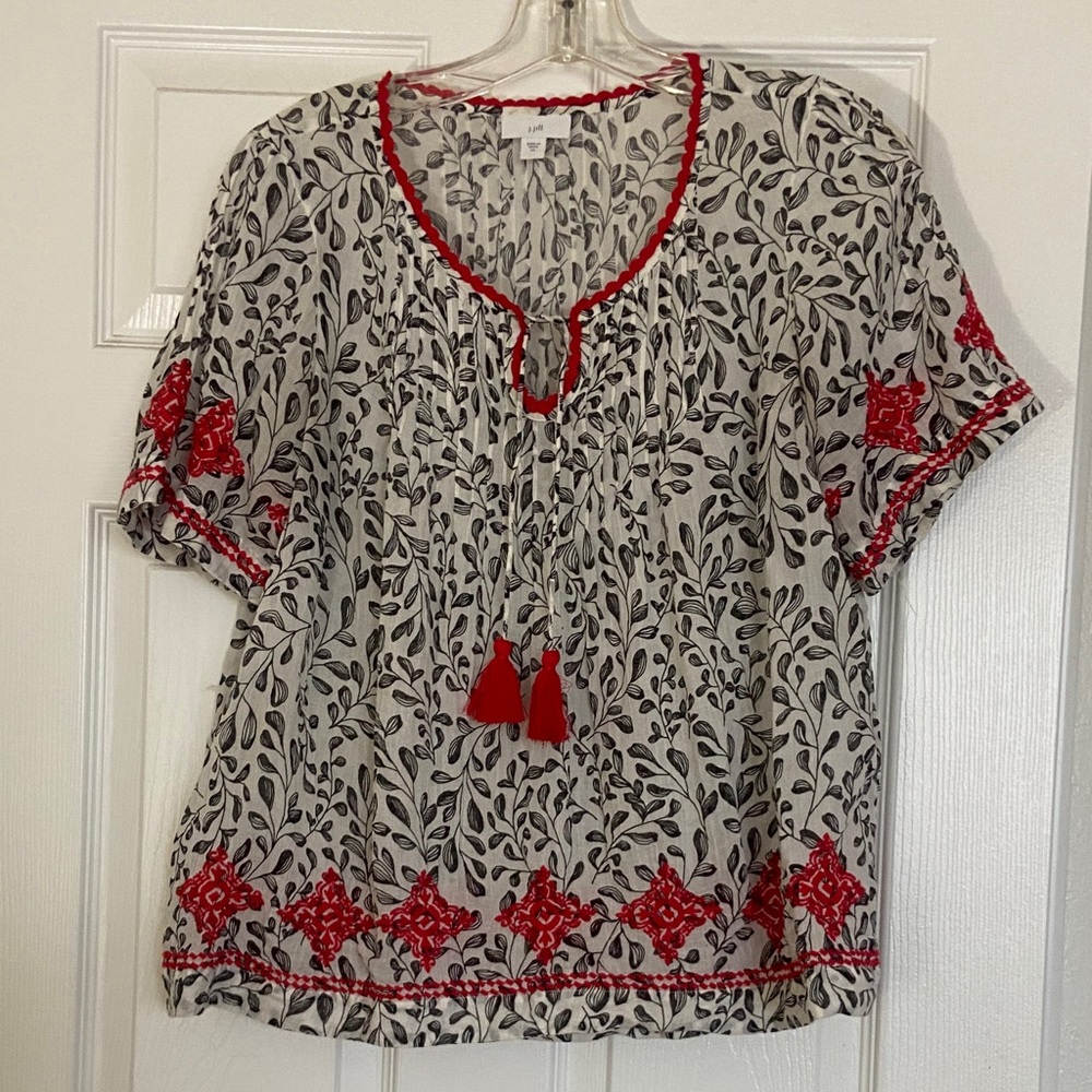 Elegant Black and White Blouse with Embroidered Red Details